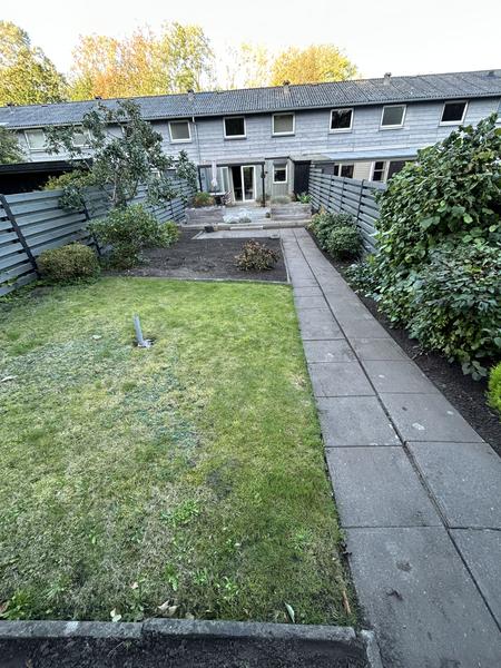 Anlægning af ny græsplæne og lægning af fliser